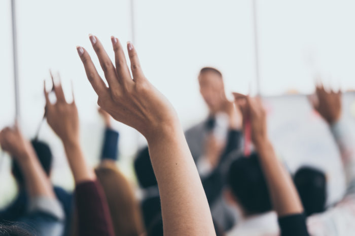 image of hands being raised