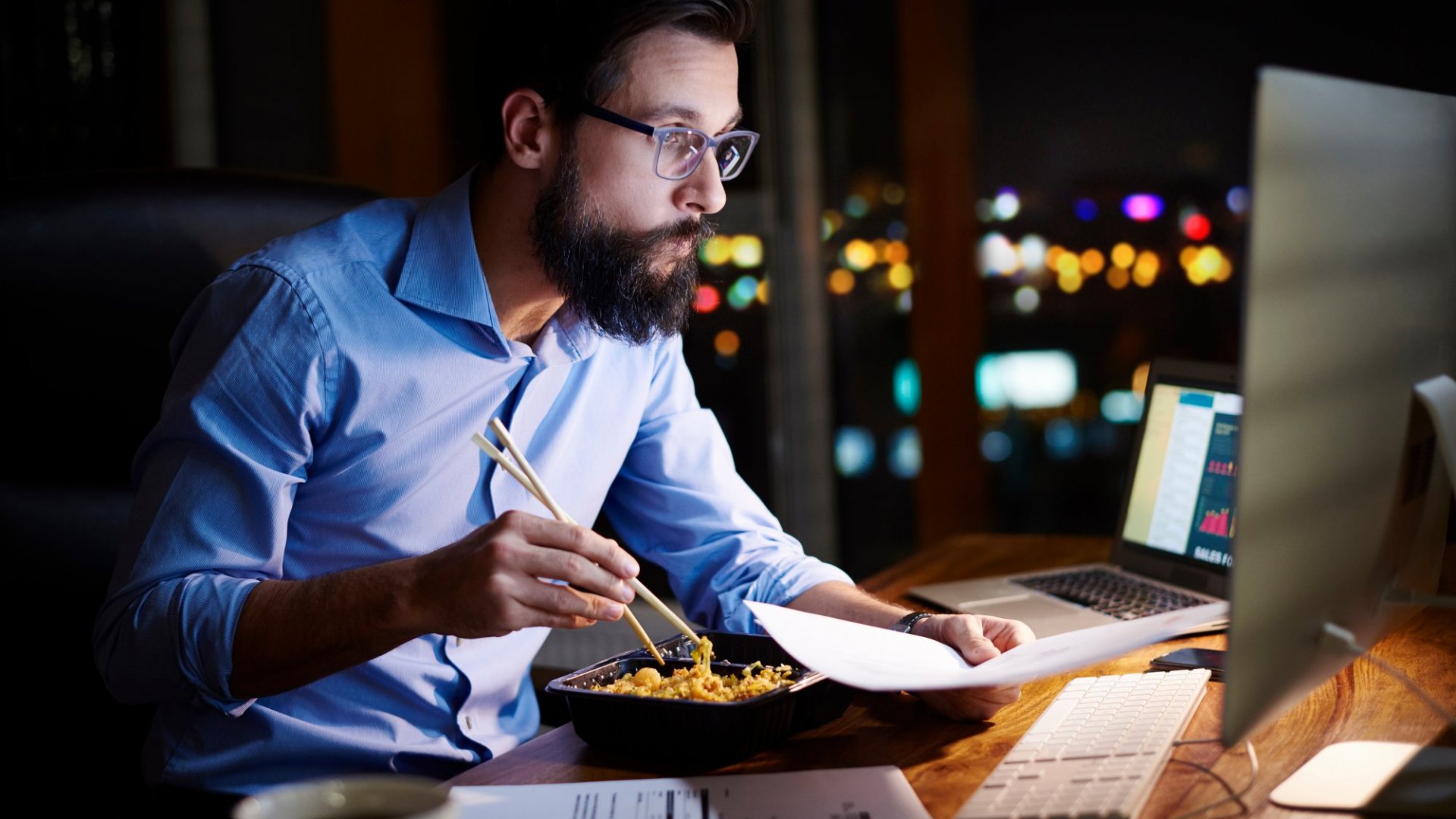 man late night working with food